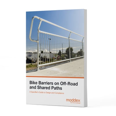 Bike barriers on off-road and shared paths whitepaper cover by Moddex, showing a compliant bicycle barrier installed on a shared pedestrian and cycling path.