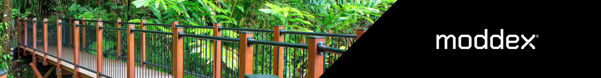 Moddex modular balustrades with powder coated black infill panels integrated into a boardwalk at Babinda Boulders in Cairns rainforest setting.